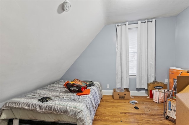 107 Lenox Ave, Providence, RI 02907 - bedroom featuring lofted ceiling and wood finished floors