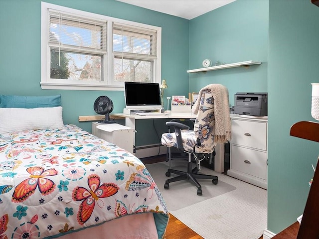 bedroom with a baseboard radiator