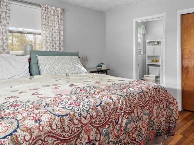 bedroom featuring wood finished floors