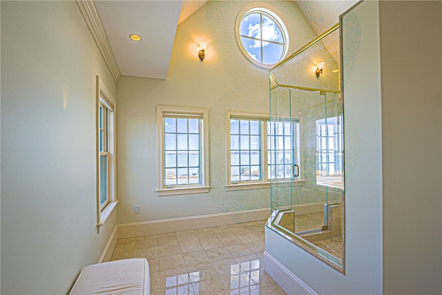 interior space with recessed lighting, a shower stall, and baseboards