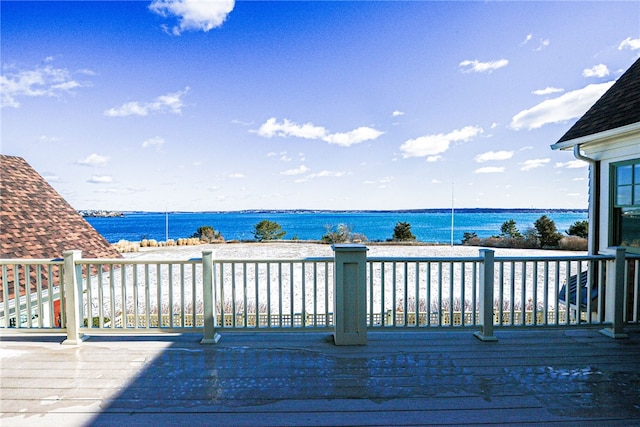 wooden terrace with a water view