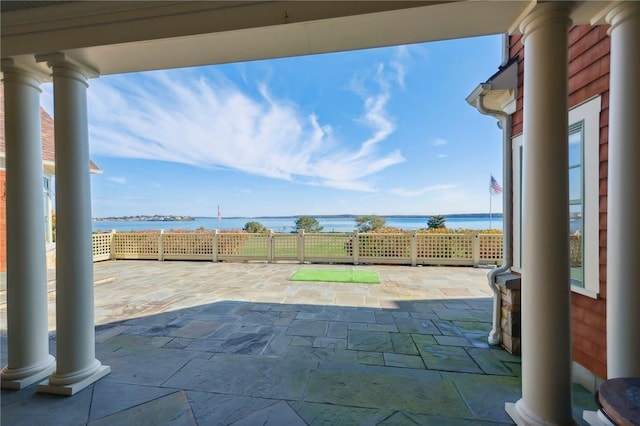 view of patio featuring a water view