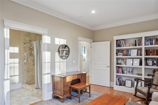 home office featuring baseboards, wood finished floors, and crown molding