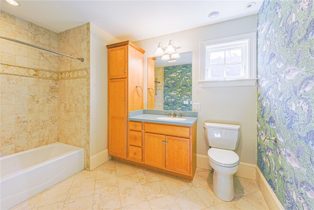 bathroom with shower / bath combo, baseboards, vanity, and toilet