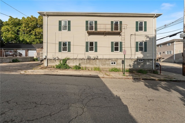 rear view of house featuring a balcony