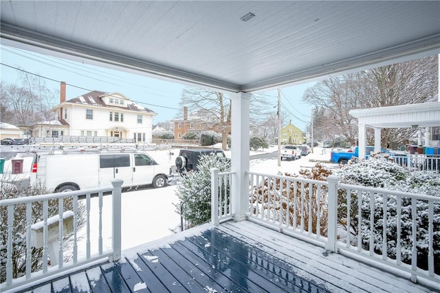 view of snow covered deck