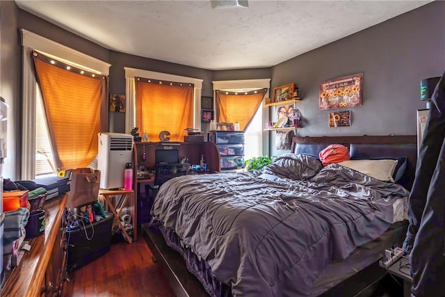 bedroom with wood finished floors