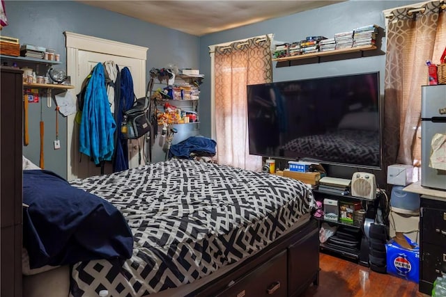 bedroom with wood finished floors