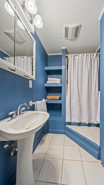 full bathroom with visible vents, crown molding, a shower with shower curtain, and tile patterned floors