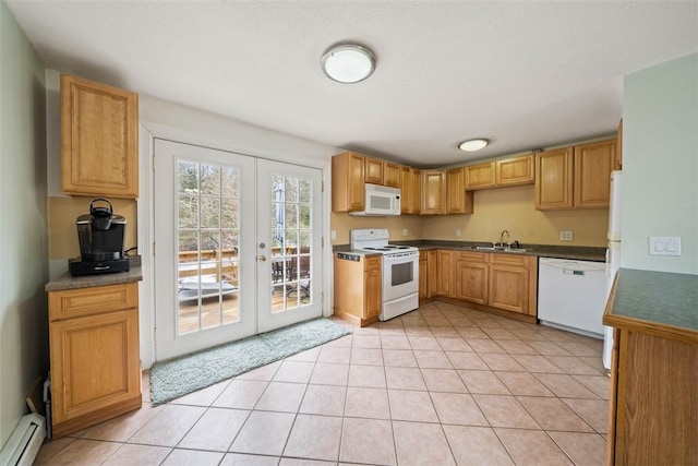 kitchen featuring light tile patterned floors, white appliances, a sink, french doors, and baseboard heating