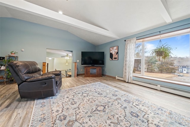 living area featuring a baseboard heating unit, wood finished floors, a ceiling fan, baseboards, and vaulted ceiling