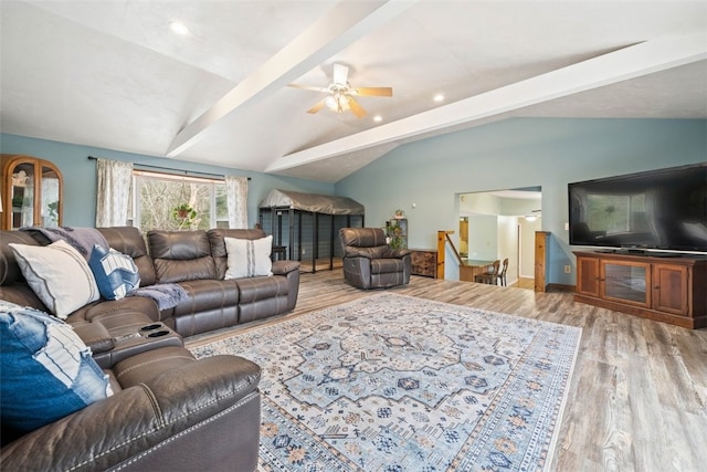 living room featuring vaulted ceiling with beams, ceiling fan, recessed lighting, wood finished floors, and stairway