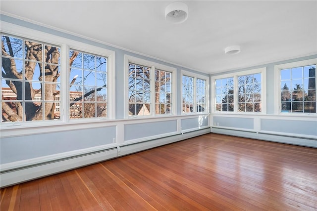 unfurnished sunroom featuring a baseboard radiator