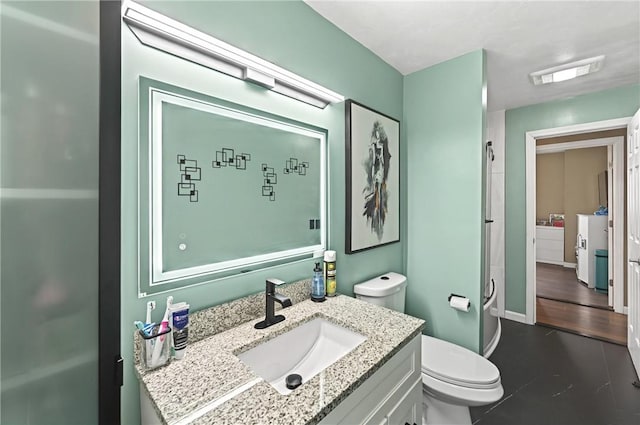 bathroom featuring baseboards, visible vents, vanity, and toilet