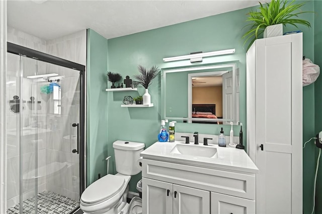 full bathroom with toilet, a shower stall, and vanity