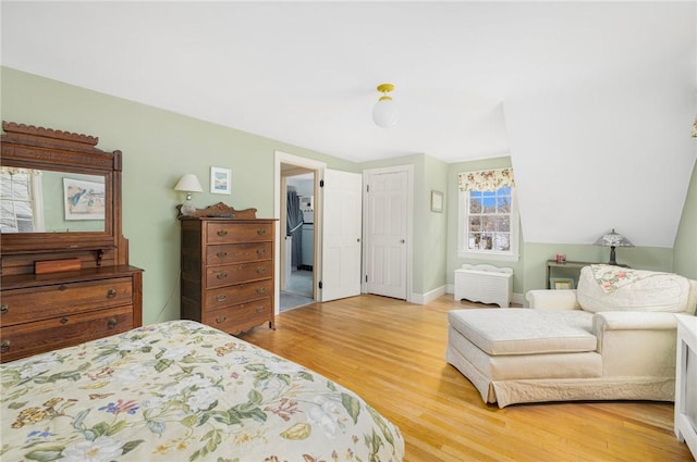 bedroom featuring baseboards and light wood-style floors