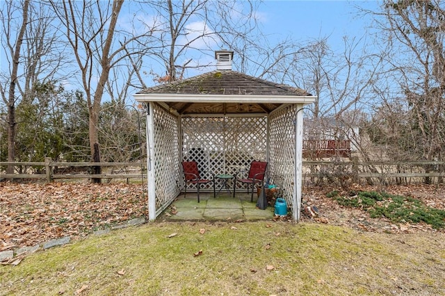 view of yard with fence and a gazebo