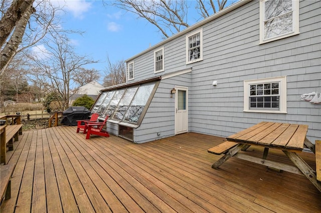 wooden terrace featuring area for grilling