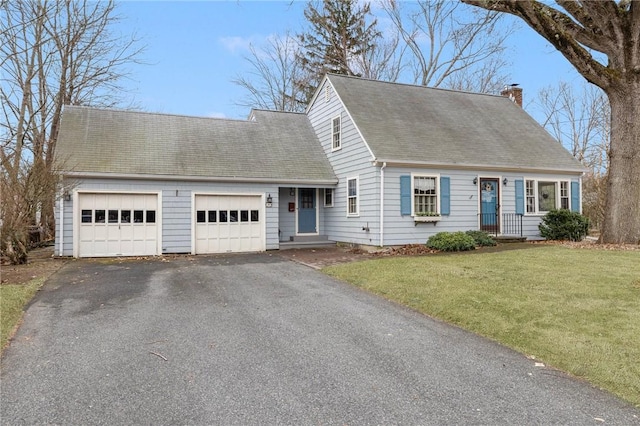 cape cod home with aphalt driveway, roof with shingles, a chimney, an attached garage, and a front yard