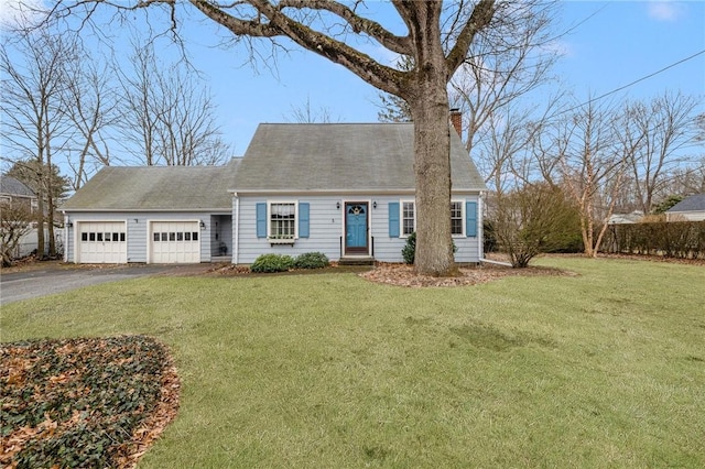 cape cod home with a garage, aphalt driveway, a front lawn, and a chimney