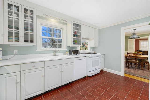 kitchen featuring white appliances, a sink, white cabinetry, glass insert cabinets, and crown molding