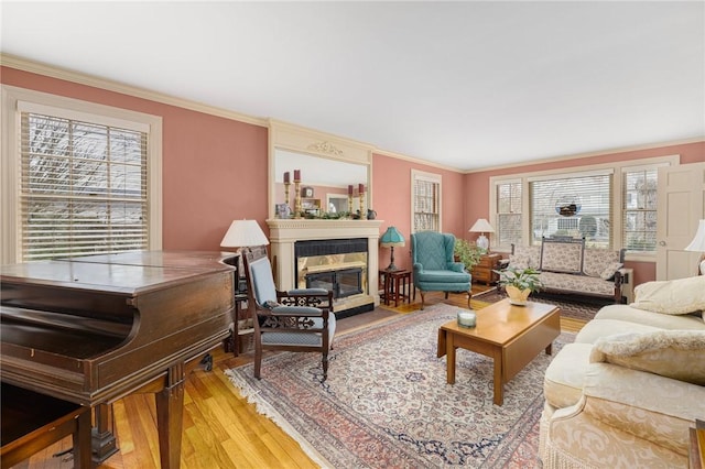 living area with plenty of natural light and crown molding