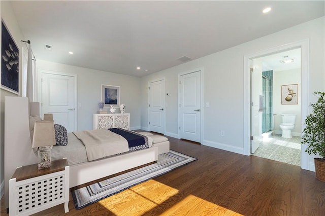 bedroom with recessed lighting, visible vents, connected bathroom, wood finished floors, and baseboards