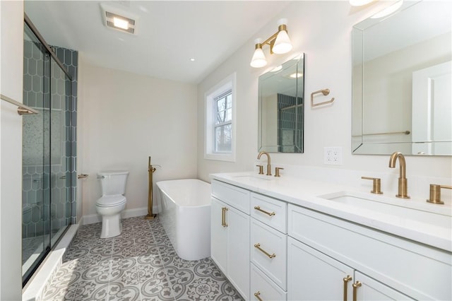 full bathroom with a freestanding tub, tile patterned flooring, a sink, and a shower stall