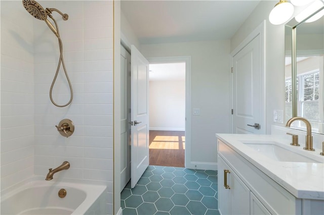 full bath with shower / bath combination, vanity, and baseboards