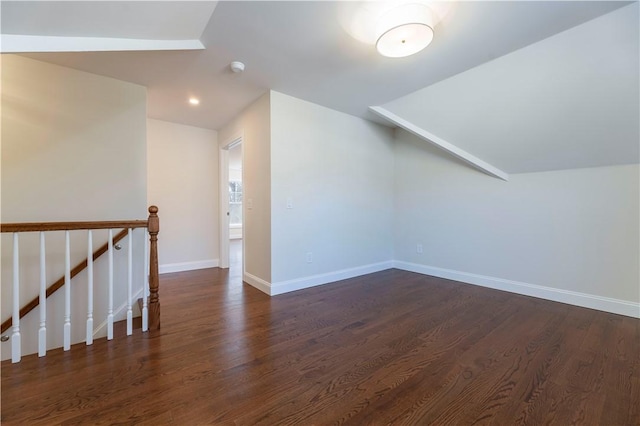 additional living space with lofted ceiling, dark wood-style flooring, baseboards, and recessed lighting