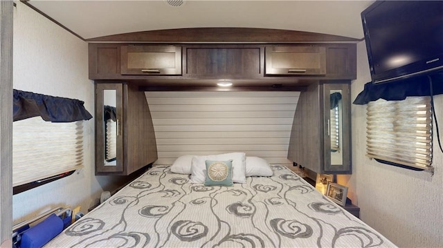 bedroom featuring lofted ceiling