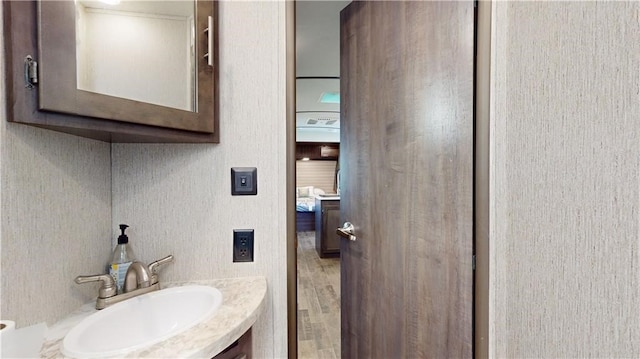 bathroom featuring vanity and wood finished floors