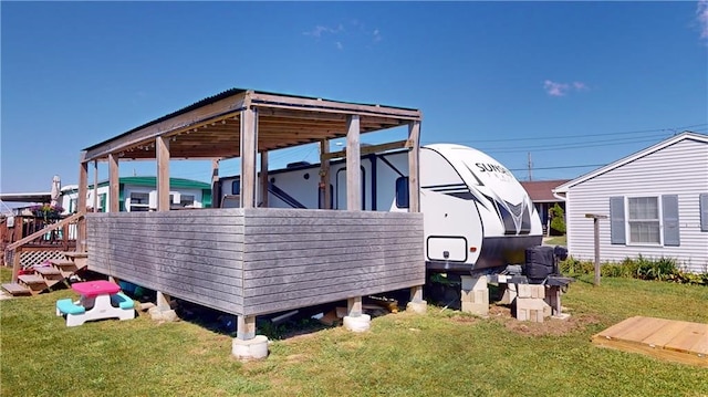 view of home's exterior featuring a carport and a yard