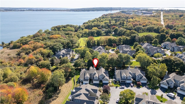 birds eye view of property with a water view and a residential view