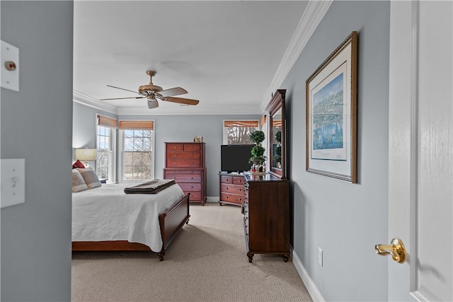 bedroom featuring light carpet, ceiling fan, baseboards, and crown molding