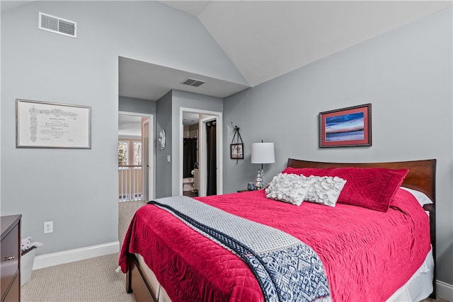 bedroom featuring vaulted ceiling, carpet floors, a spacious closet, and visible vents