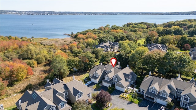 bird's eye view featuring a water view and a residential view