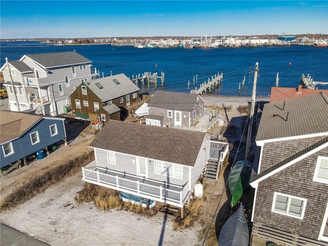 birds eye view of property featuring a water view and a residential view