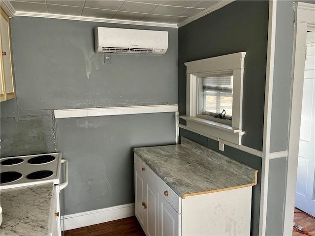 kitchen featuring electric range, dark wood-type flooring, white cabinetry, ornamental molding, and a wall mounted air conditioner