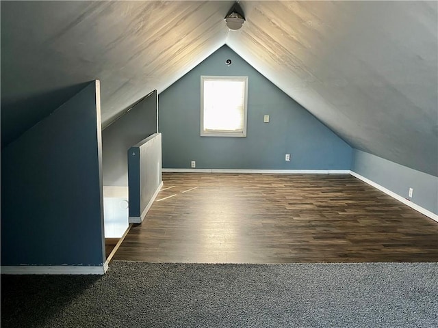 bonus room featuring vaulted ceiling, wood finished floors, and baseboards