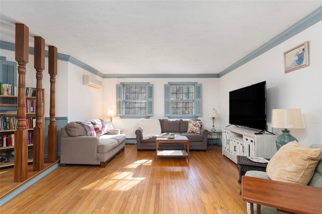 living area featuring ornamental molding, a baseboard radiator, light wood finished floors, and a wall mounted AC