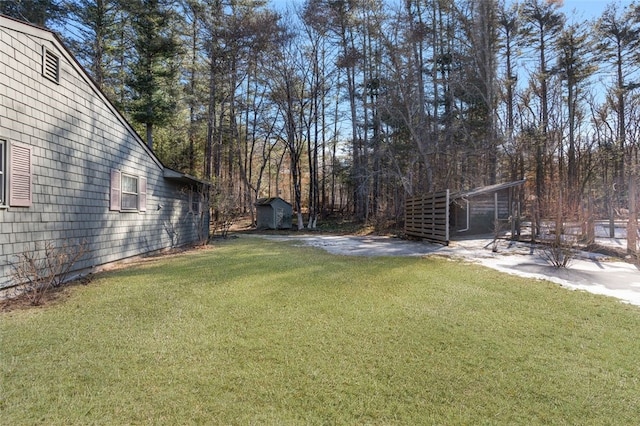 view of yard with a shed and an outdoor structure