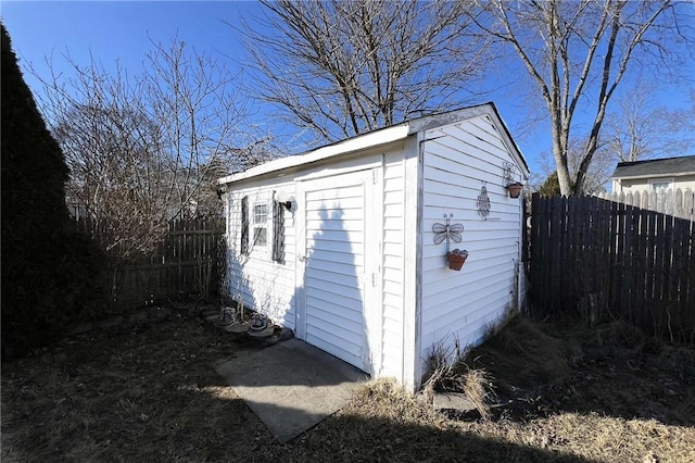 view of shed with a fenced backyard