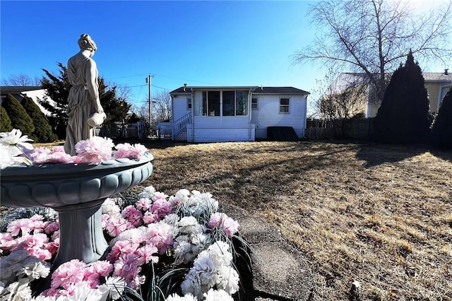 view of front of home with fence