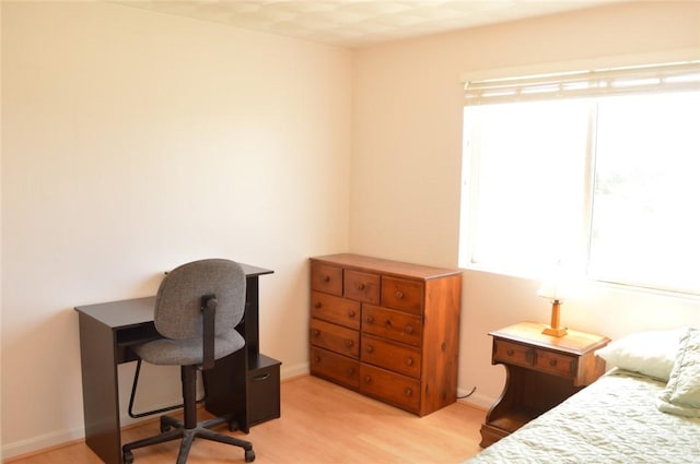 bedroom with light wood-style floors