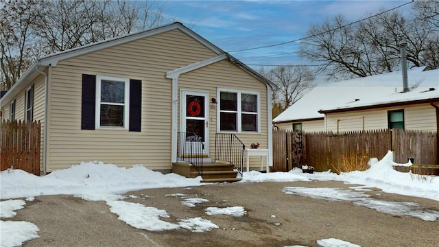 view of front of property featuring fence