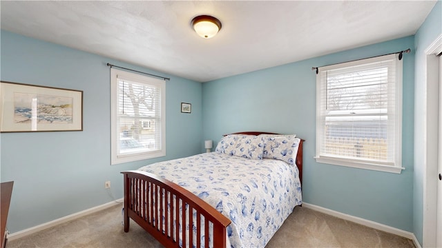 bedroom featuring carpet floors and baseboards