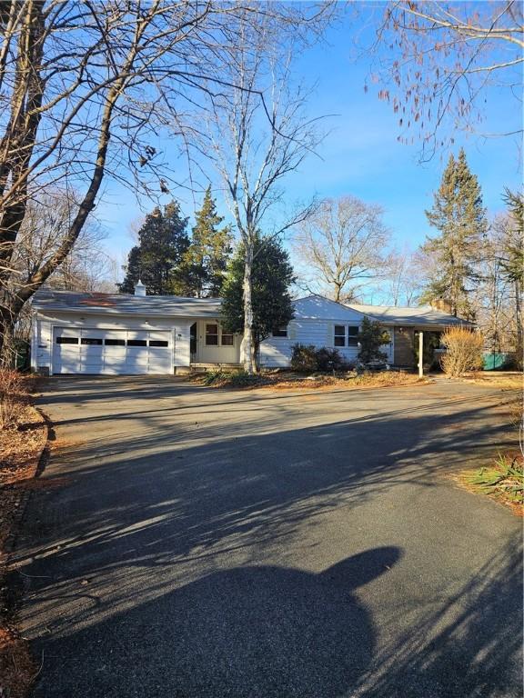 view of front facade with driveway and an attached garage