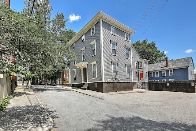 view of building exterior featuring fence