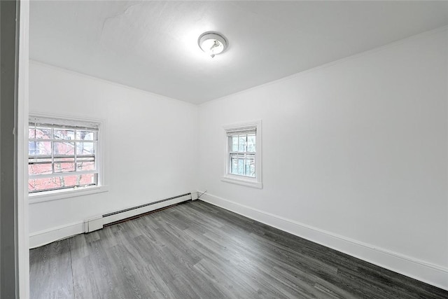 unfurnished room featuring a healthy amount of sunlight, a baseboard radiator, baseboards, and dark wood-style flooring